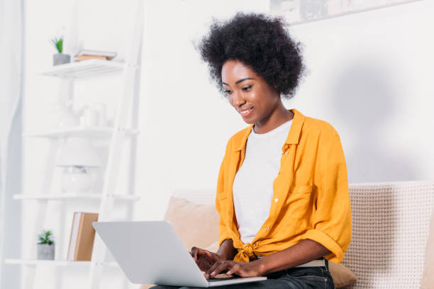 istock african american woman using laptop at home 927856358
