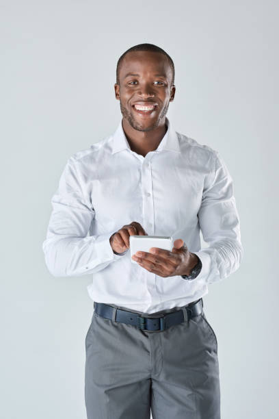 istock Black professional business man with his touchscreen tablet 927868464
