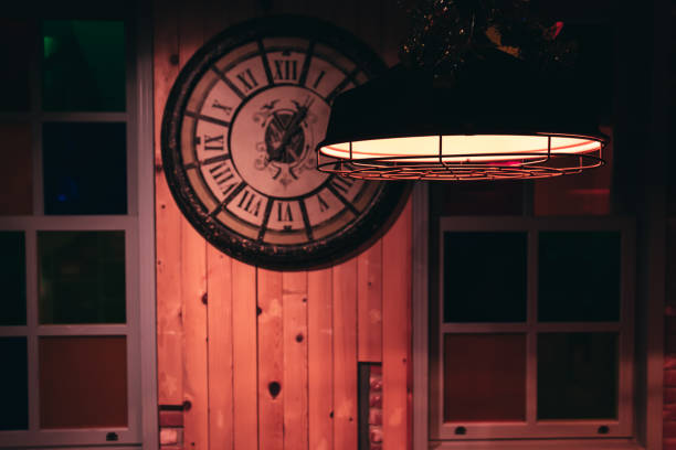 old lamp and antique clock on the wall vintage interior decorations