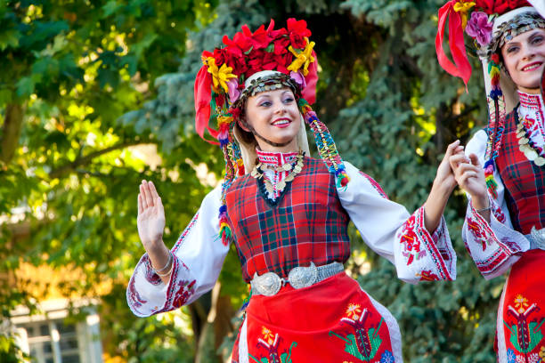 Bulgarian national folklore dances Plovdiv, Bulgaria 3rd August 2013: Beautiful Bulgarian women dancers performing on stage of the XIX International Folklore Festival. The festival is a traditional event organized for the residents and guests of the town. bulgarian culture photos stock pictures, royalty-free photos & images