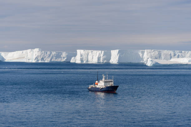 istock Expedition ship with iceberg aerial view 927881152
