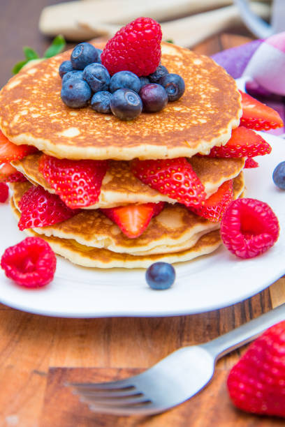 istock dish with pancakes and strawberry,raspberry and blueberry and chocolate 927885330