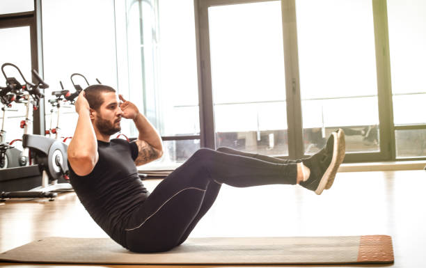 istock Young sportsman exercise abdominal muscle. 927887734
