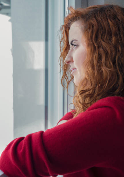 istock Girl  by the window 927888558