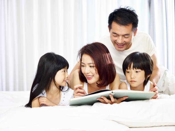istock happy asian family having fun together 927888714