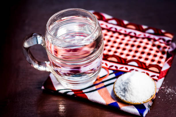 istock Water & salt,sodium chloride on wooden surface. 927889230