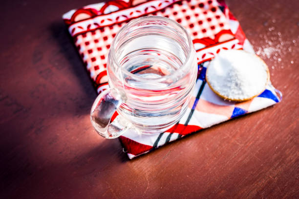 istock Water & salt,sodium chloride on wooden surface. 927889256
