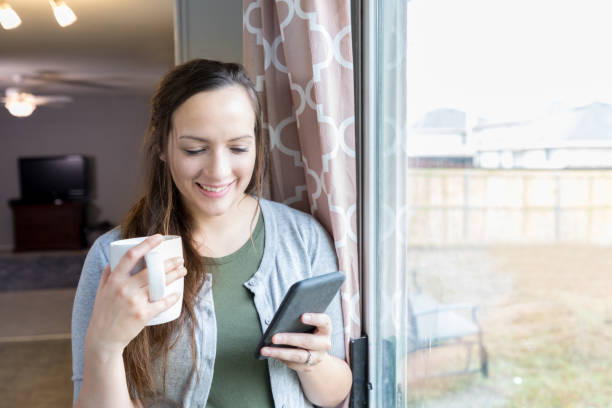 istock Cheerful woman video conferences with a friend 927892204