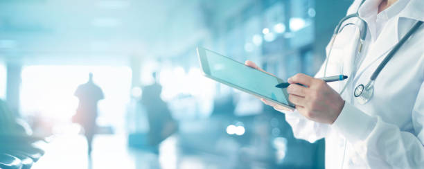 Medicine doctor and stethoscope touching medical information network connection interface on digital tablet in hospital background. Medical data and technology network concept Medicine doctor and stethoscope touching medical information network connection interface on digital tablet in hospital background. Medical data and technology network concept tablet pc and digital hospital tools stock pictures, royalty-free photos & images
