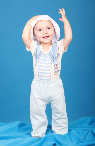 istock The kid in the sailor suit standing and smiling 927897176