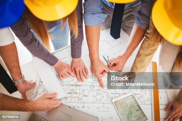 Checking Plan Project Stock Photo - Download Image Now - Teamwork, Electrician, Construction Industry