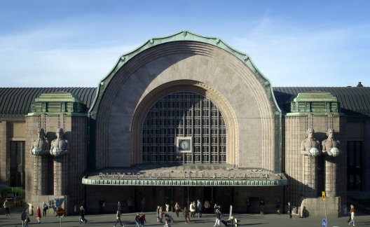 View of the main entrance of the railway station of Helsinki, Finland. The building is designed by architect Eliel Saarinen.