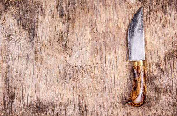 istock Hand knife on wooden board. Kitchen knife and cutting board. Top view. Copy space. 927911988