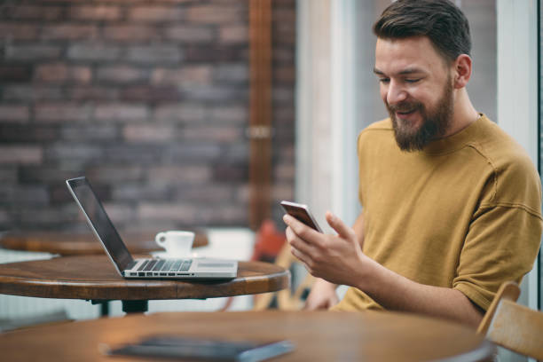 istock Young man sitting in cafe. 927912132