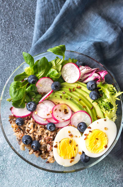 istock Bowl of wild rice with avocado, egg and lettuce 927912596