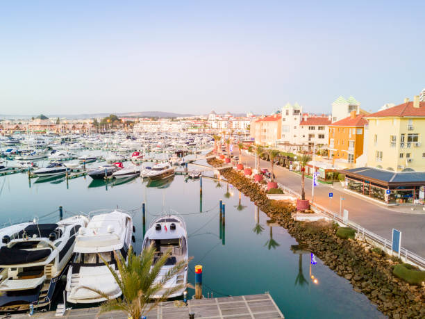 View of marina in touristic Vilamoura in Algarve, Portugal View of marina in touristic Vilamoura, Quarteira, Algarve, Portugal faro district portugal photos stock pictures, royalty-free photos & images