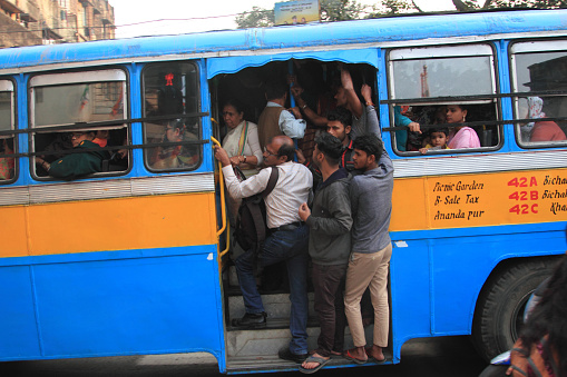 Kolkata, India -January 16,2018 : Unidentified people travel in public buses near Howrah bridge in Kolkata, West Bengal,India.