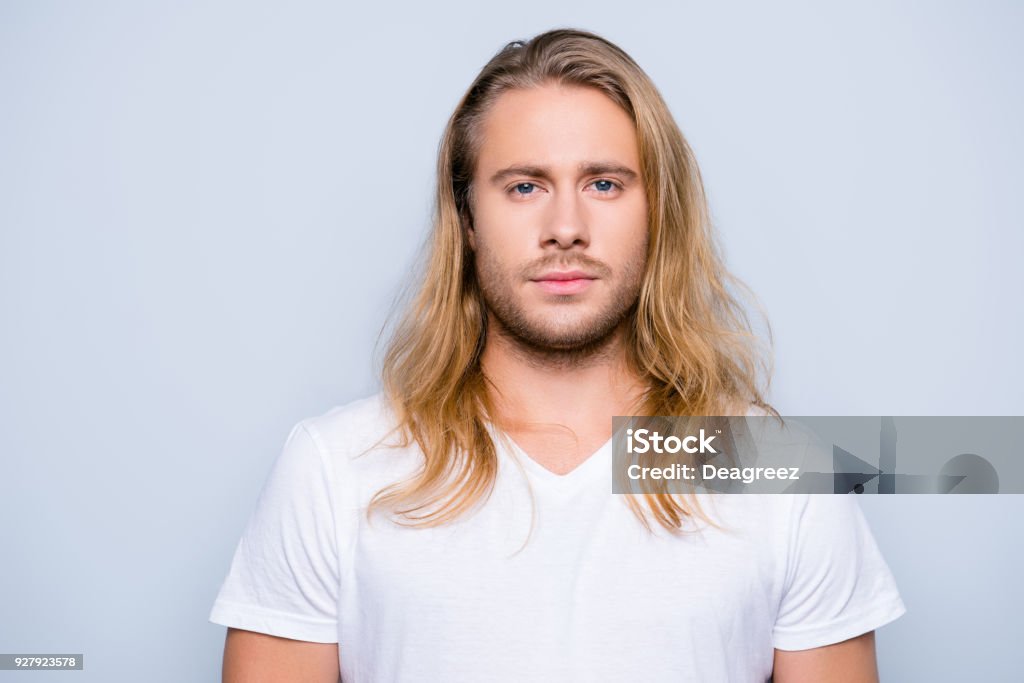 Portrait Of Handsome Young Serious Confident Young Guy With Blonde Long Hair  In White Tshirt Isolated On Grey Background Stock Photo - Download Image  Now - iStock
