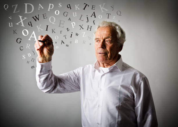 istock Old man in white is writing something. Old man in white and letters. 927924800