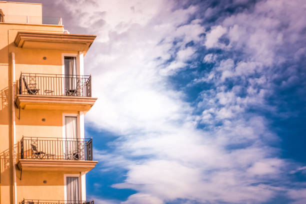 istock Modern building part with balcony on a blue sky 927927582