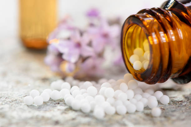 alternative medicine with herbal and homeopathic pills stock photo