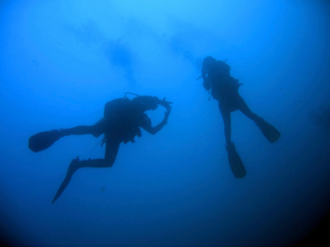 Teenager snorkeling with full-face snorkel mask in clean waters of Ligurian sea in the town of Rapallo.\nShow with Canon R5