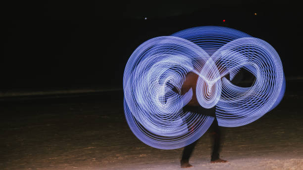 istock Man dancers with LED lamp, very beautiful night party. 927950174