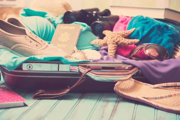 istock Summer vacation items with suitcase. 927950278