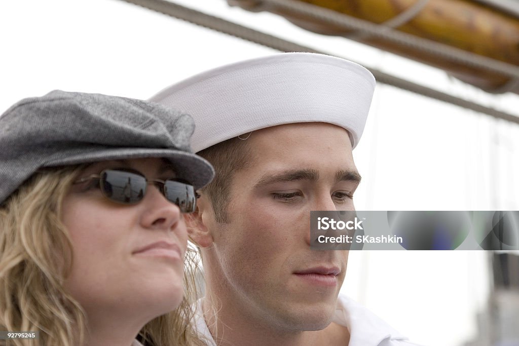 End of vacation time Classic story: She is happy to see him, he is thinking about tomorow (have to came back to war). Adult Stock Photo