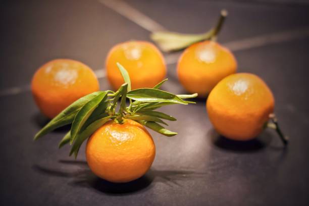 istock Tangerine  with leaf.Shallow depth of focus. 927958206
