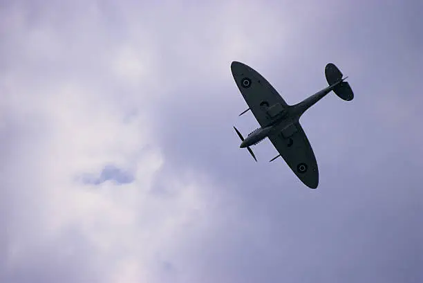A Spitfire Mark 9 flies through the skies of England.