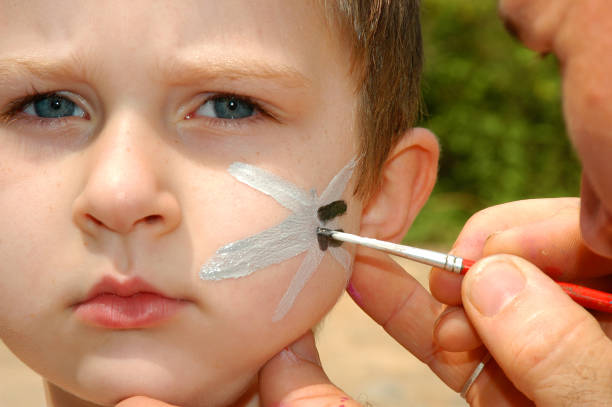 istock Little boy has his face painted 92796026