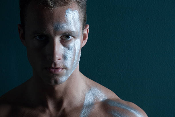 istock Strong man portrait with his face painted 92796233