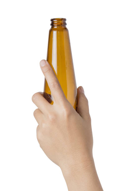 istock Woman's hand holding empty alcohol bottle transparent on white background, File contains a clipping path. 927974850