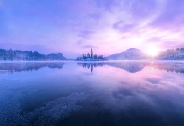 Aerial view of Bled lake in sunrise light, beautiful island with old church. Slovenia