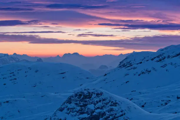 Beautiful sunset over Alpine mountains. Outdoor winter scenery