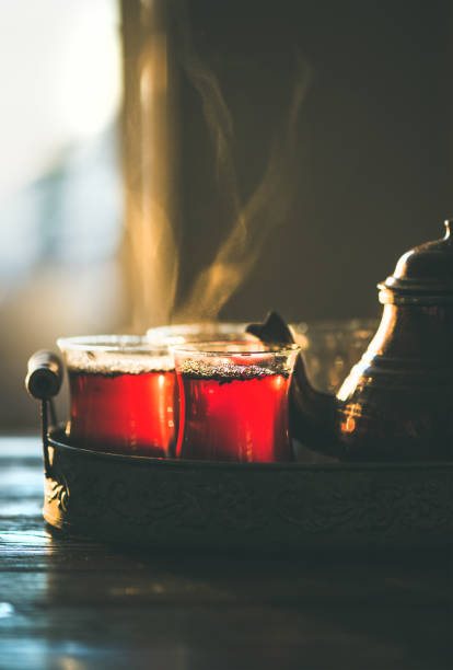 istock Freshly brewed traditional black tea in turkish tukip glasses 927986246