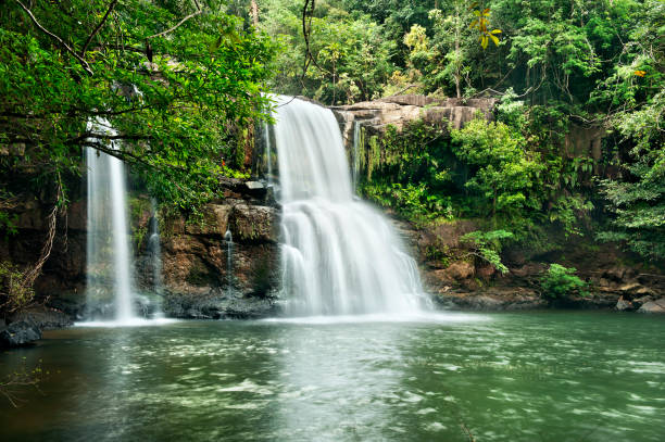 istock Waterfall in thai national park. In the deep forest on mountain 927987596