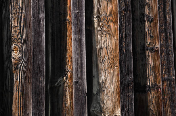 istock new dark wooden boards with brown spots and bulges 927990724