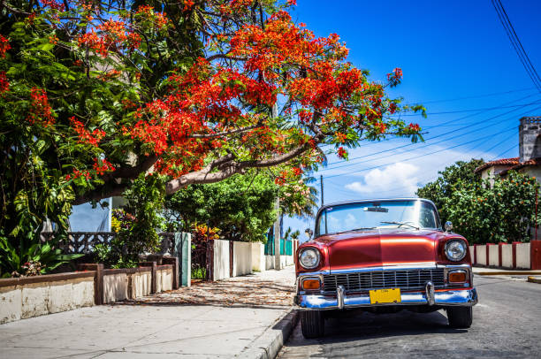 HDR - Red american convertible vintage car parked near the beach in a side street in Varadero Cuba - Serie Cuba Reportage stock photo