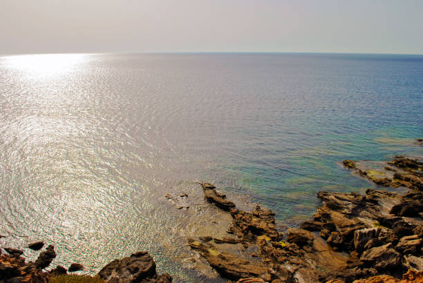 istock view of the sea with the sun in backlight 927994986