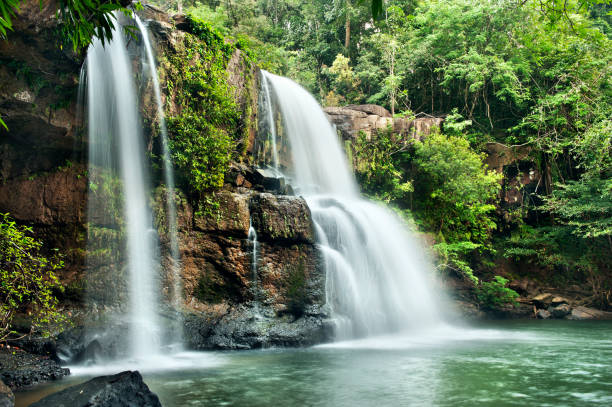 istock waterfall in thai national park. In the deep forest on mountain. 927995320