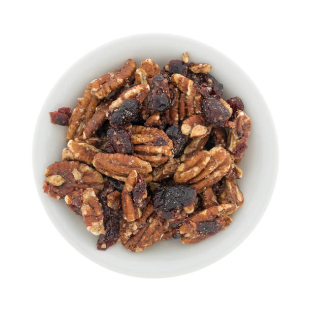 istock Sugar glazed pecans with dried cranberries in a white bowl 927995426