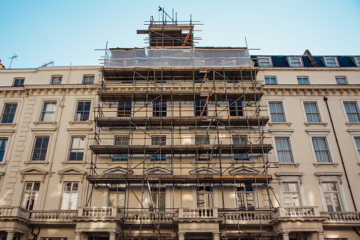 A typical house in London with a scaffolding covering its facade