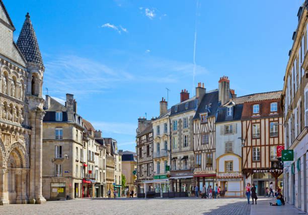 Place Charles de Gaulle with historical buildings in Poitiers, France Poitiers, France  - May 14, 2017:  Place Charles de Gaulle with historical buildings with people around historic building photos stock pictures, royalty-free photos & images