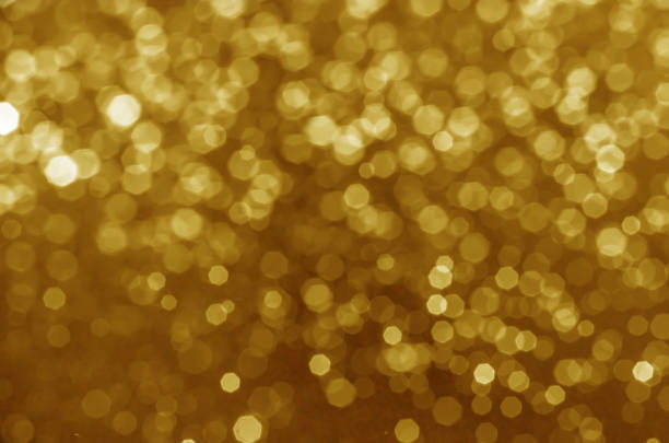 istock abstract gorgeous bright gold bokeh background. 927999204