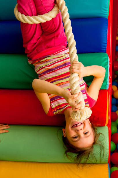 istock Kids playing in a pool of balls 928002186