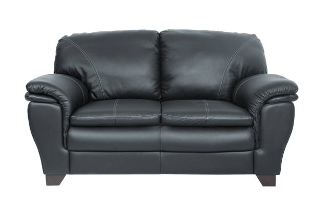 istock Two seats cozy black leather sofa isolated on white background 928002346