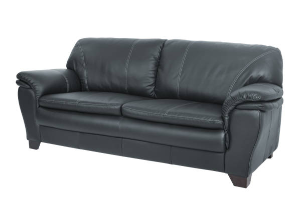 istock Three seats cozy black leather sofa isolated on white background 928002590