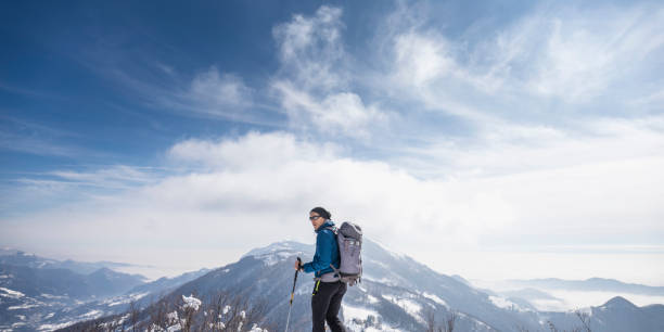 istock Alpinist on top mountain snowy 928006310